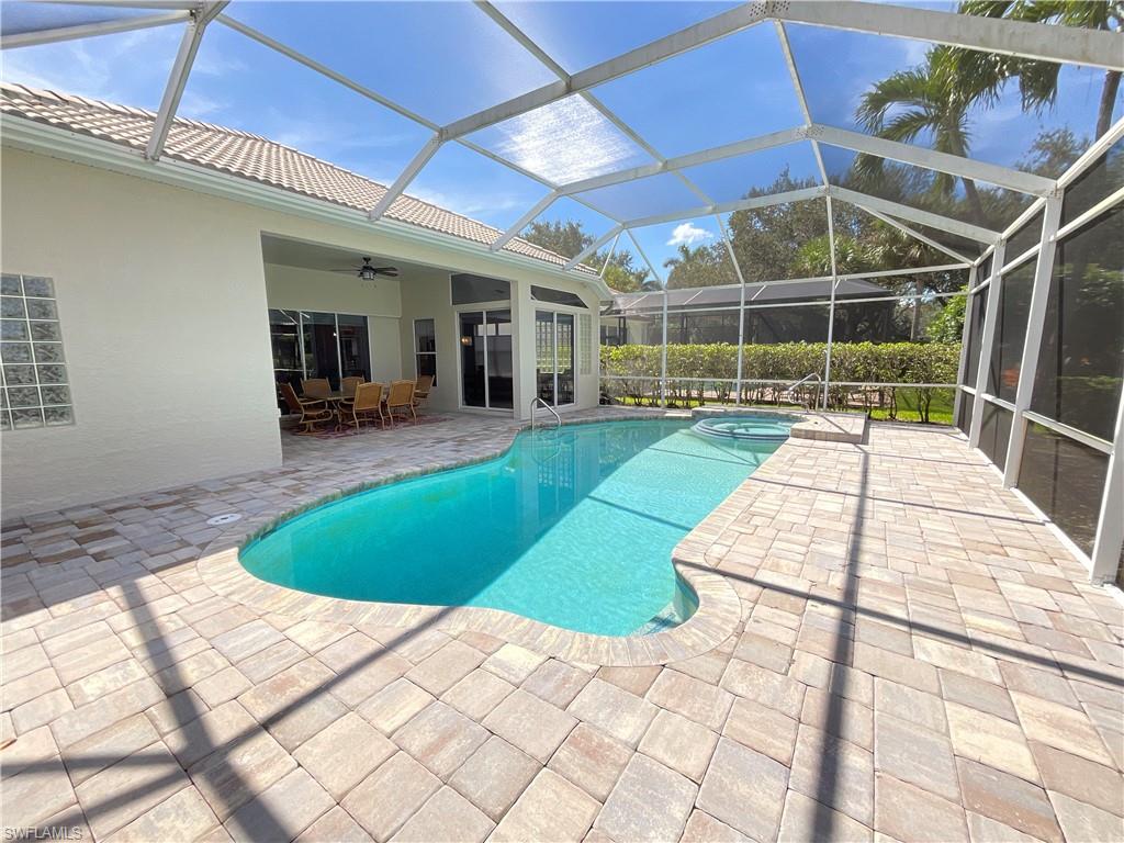 1709 Marsh Run Naples, FL 34109 - Photo 17 of 19 a view of a backyard with a patio