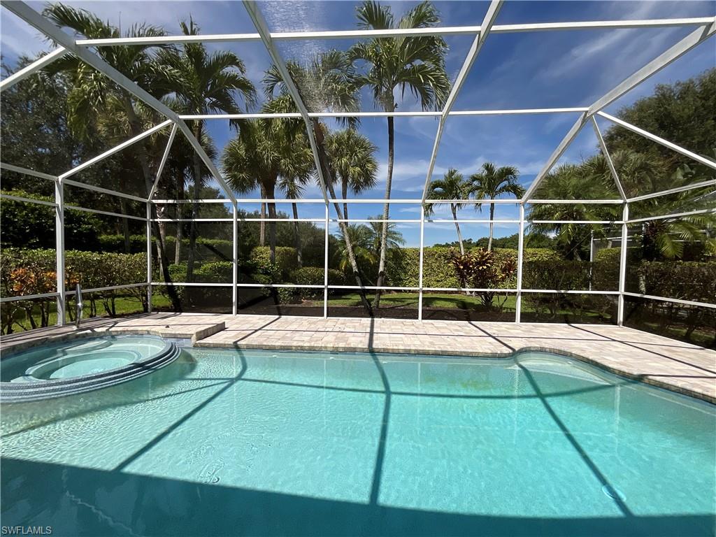 1709 Marsh Run Naples, FL 34109 - Photo 18 of 19 a view of a tennis court with wooden floor
