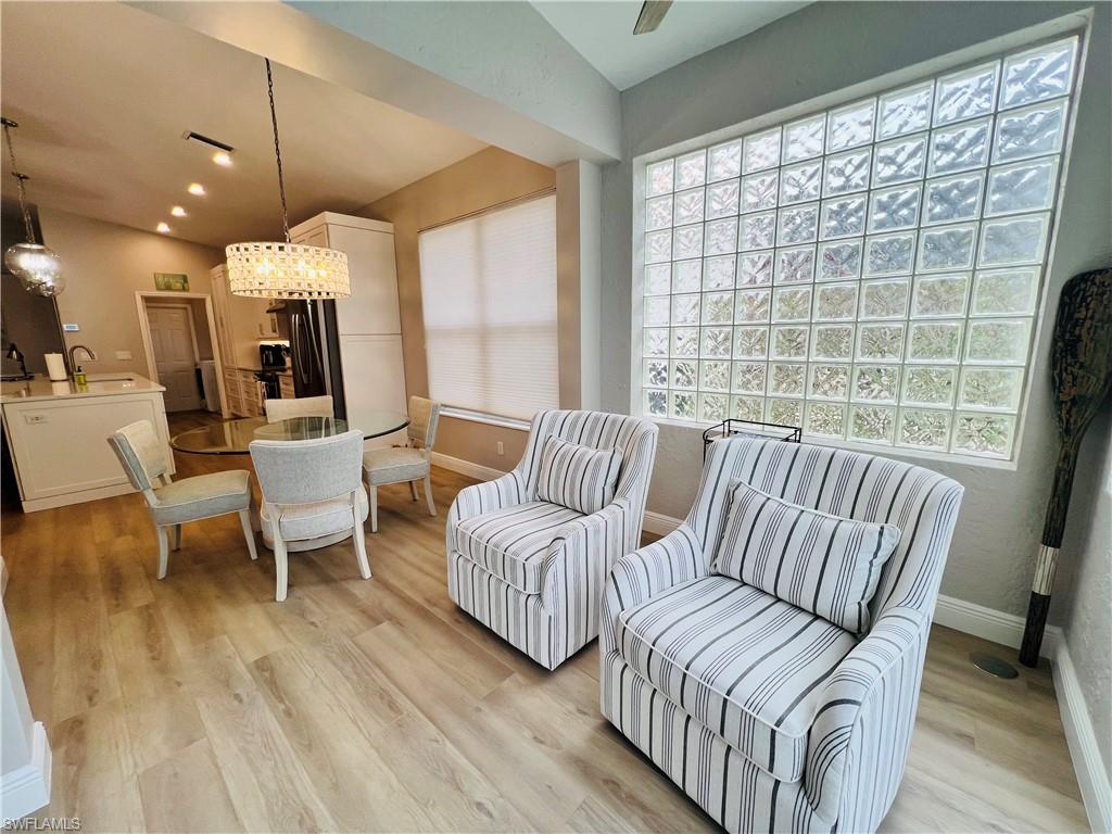 1709 Marsh Run Naples, FL 34109 - Photo 8 of 19 a living room with furniture and a large window