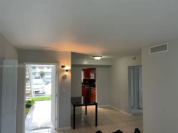 a view of a hallway with wooden shelves