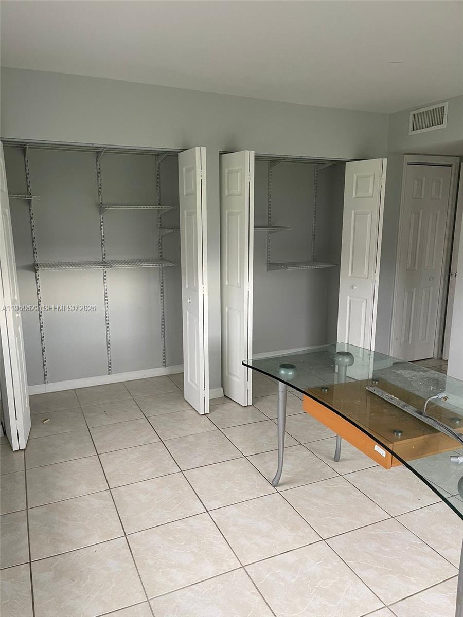 7670 Southwest 82nd Street, Unit H113 Miami, FL 33143 - Photo 11 of 14 a view of a livingroom with kitchen and furniture