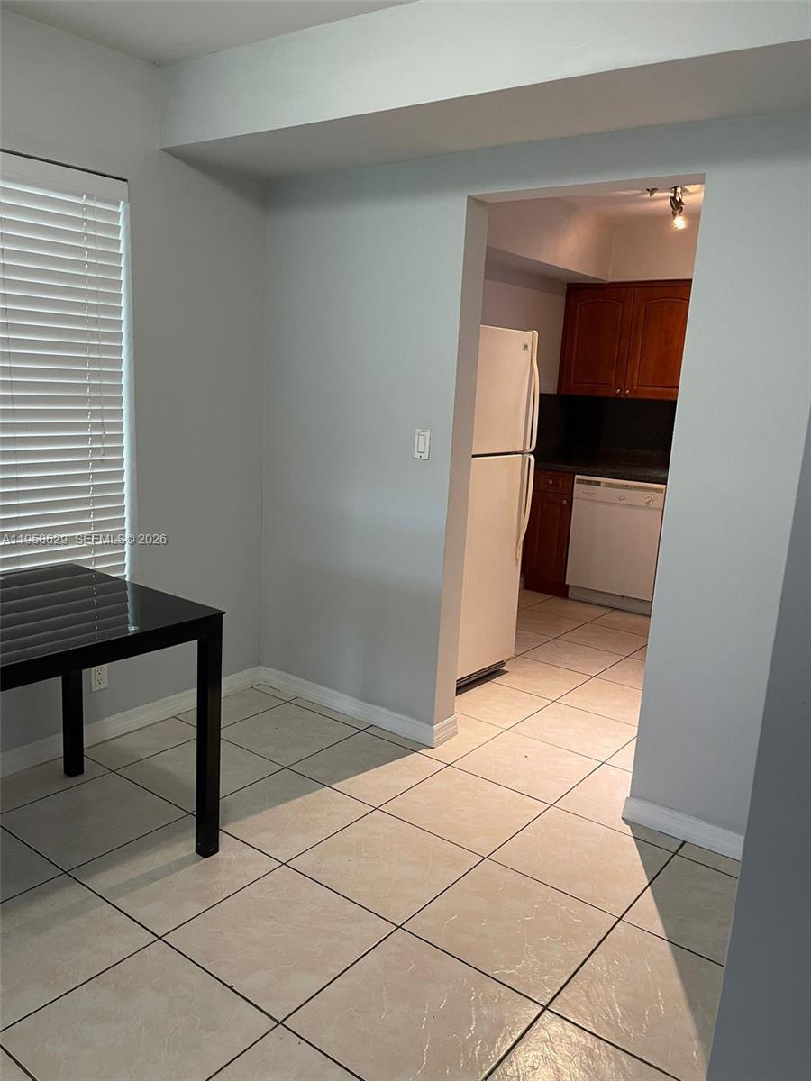 7670 Southwest 82nd Street, Unit H113 Miami, FL 33143 - Photo 2 of 14 a view of entryway with furniture