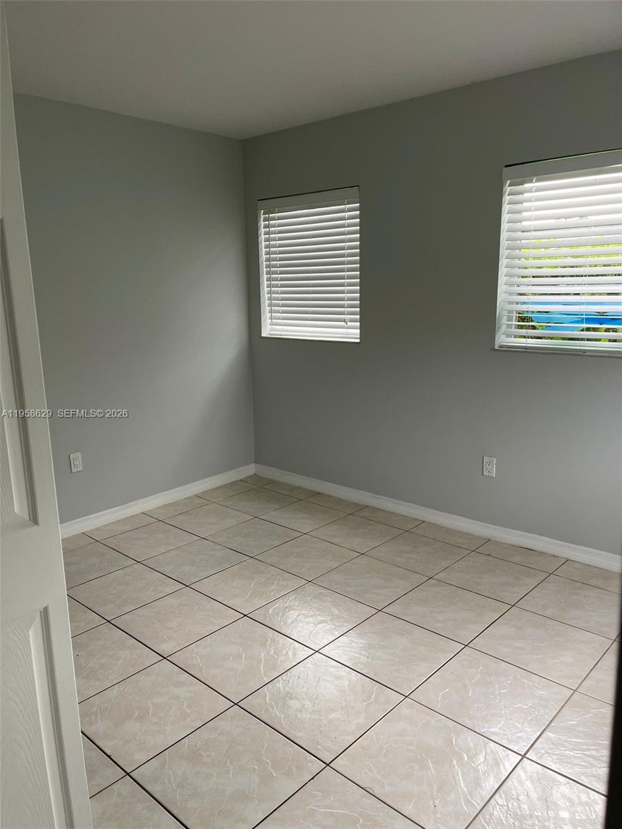 7670 Southwest 82nd Street, Unit H113 Miami, FL 33143 - Photo 8 of 14 a view of empty room