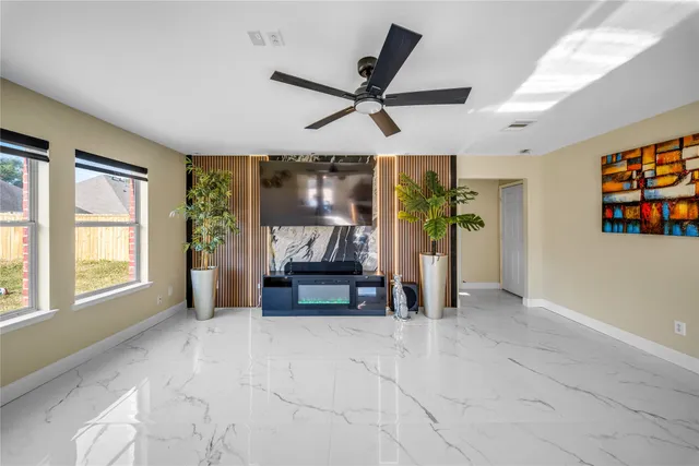 a view of a livingroom with furniture and windows