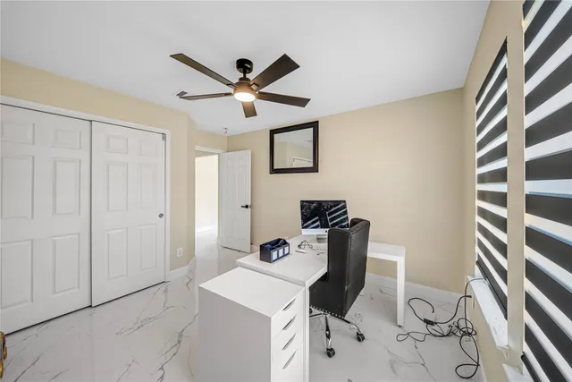 a workspace with furniture and window