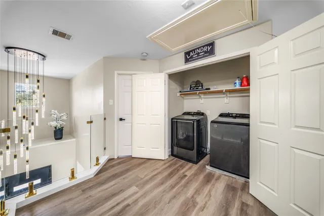 a view of a walk in closet and bedroom