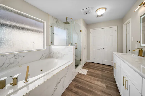 a bathroom with a bathtub and a sink