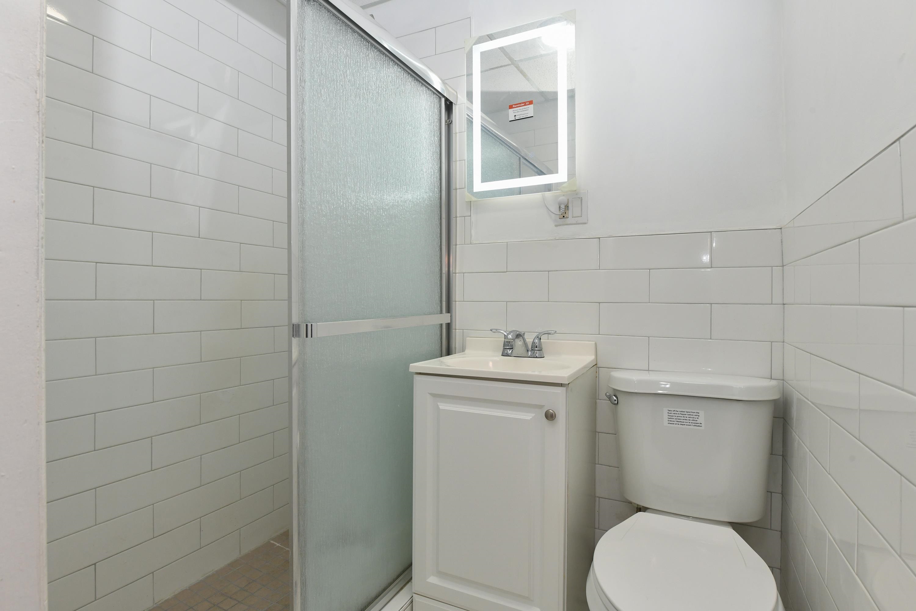 531 28th Street, Unit 1 Union City, NJ 07087 - Photo 16 of 21 a bathroom with a toilet and a sink