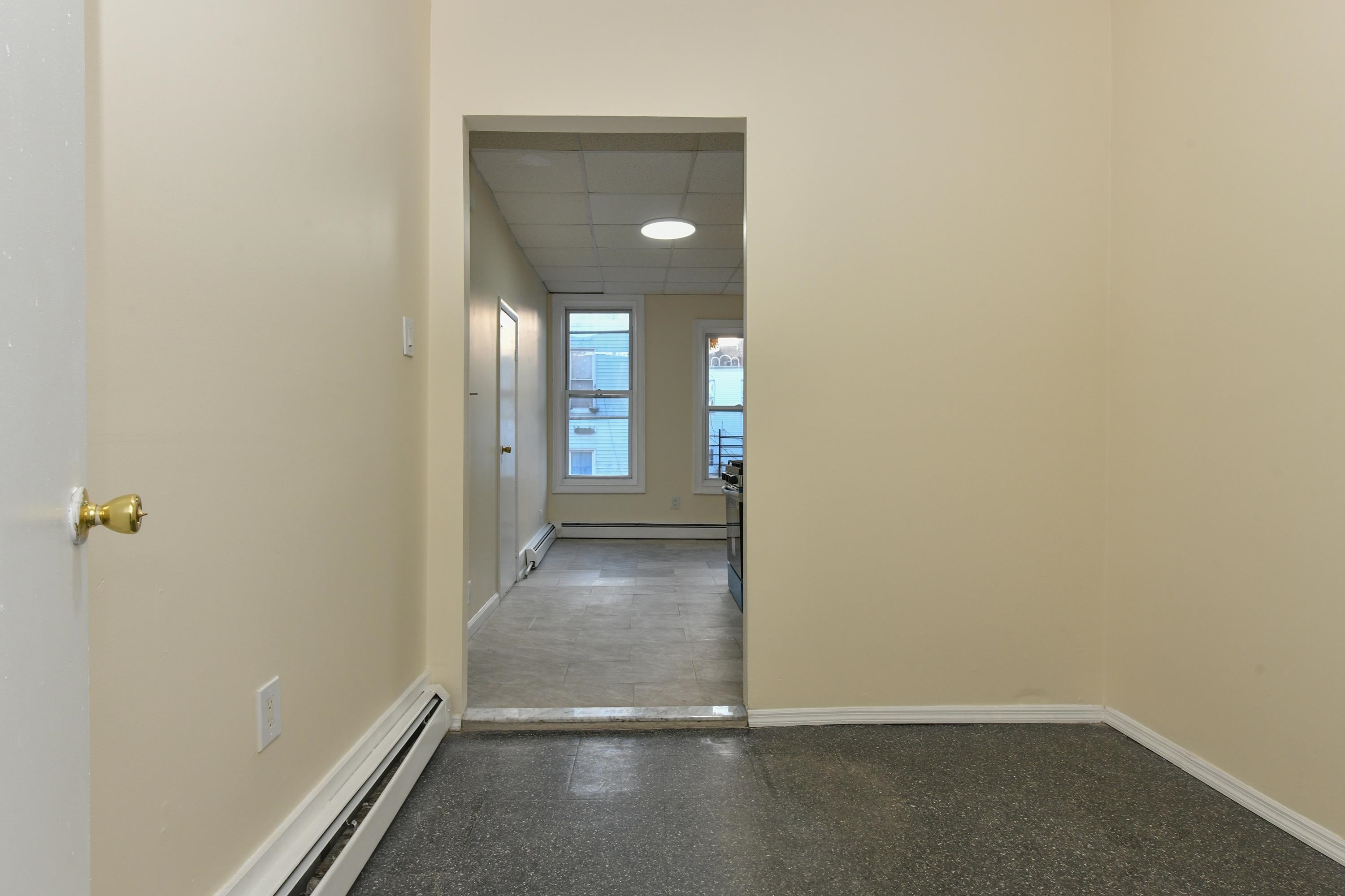 531 28th Street, Unit 1 Union City, NJ 07087 - Photo 18 of 21 a view of a hallway with wooden floor