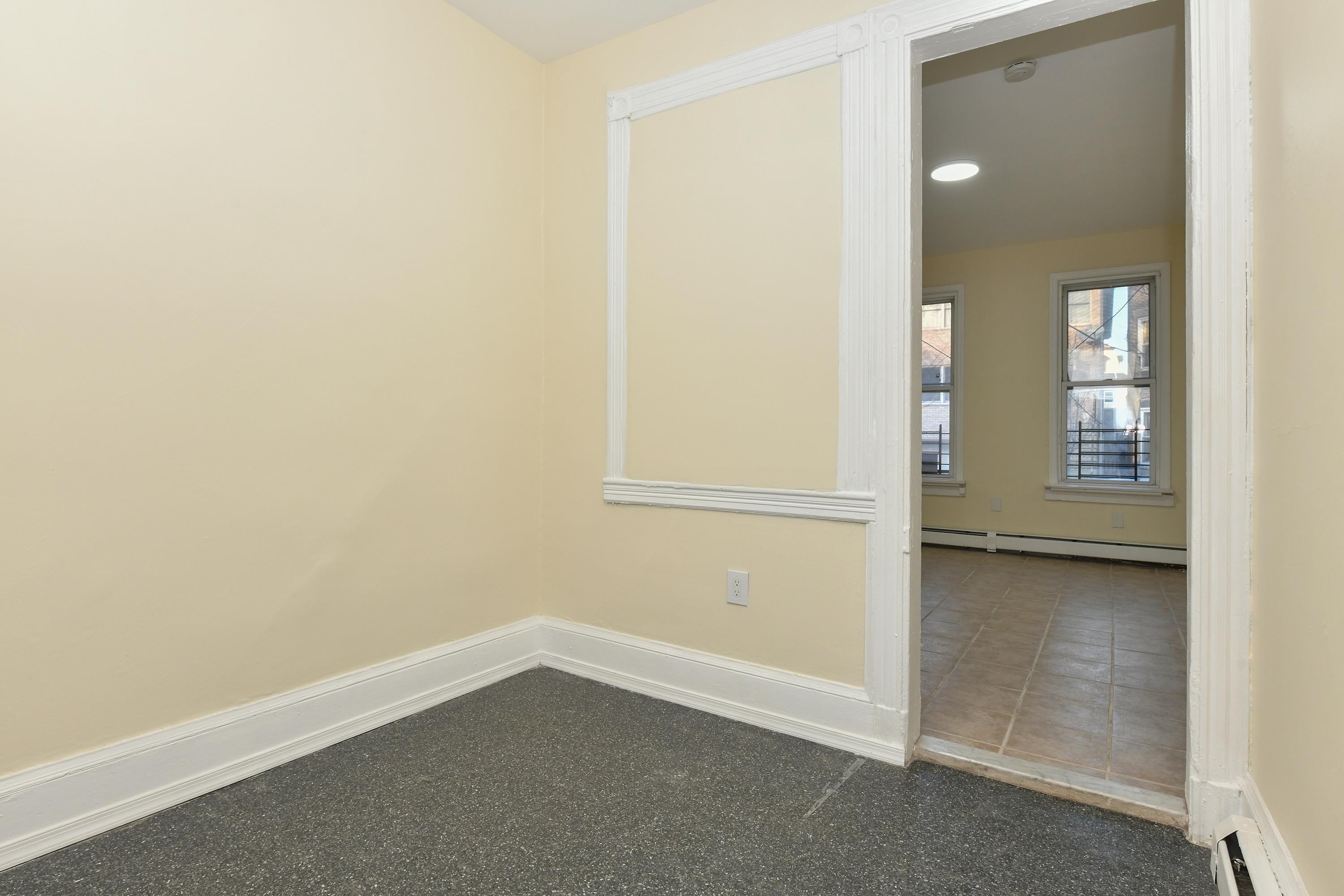 531 28th Street, Unit 1 Union City, NJ 07087 - Photo 7 of 21 an empty room with windows