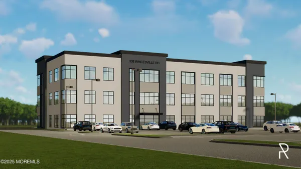 a front view of building with yard