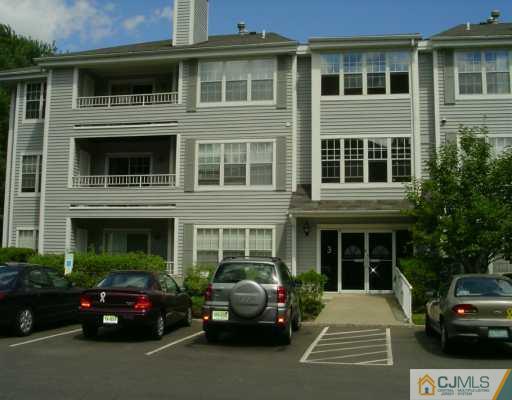 301 Raintree Court Helmetta, NJ 08828 - Photo 1 of 8 a car parked in front of a building