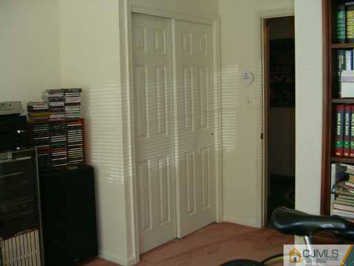 301 Raintree Court Helmetta, NJ 08828 - Photo 6 of 8 a view of a bedroom with a wardrobe space