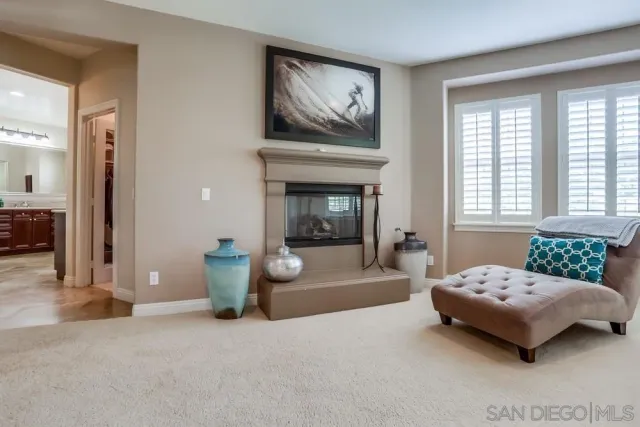 a bedroom with a bed and glass windows