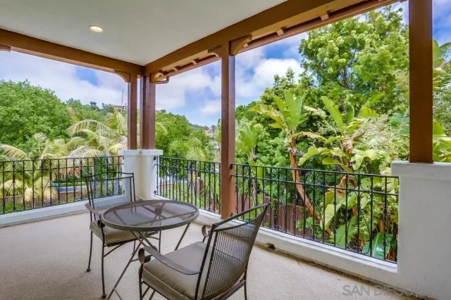 a view of a chair and table in the balcony