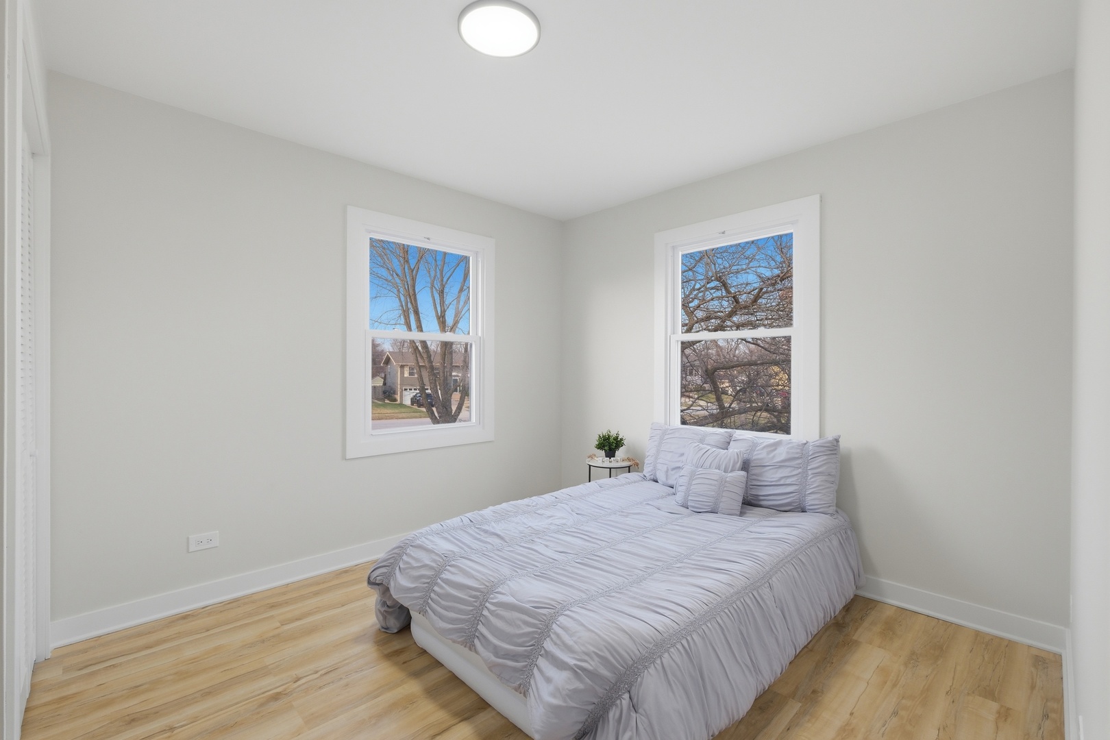 1450 Meyer Road Hoffman Estates, IL 60169 - Photo 11 of 28 a bedroom with a bed and a window