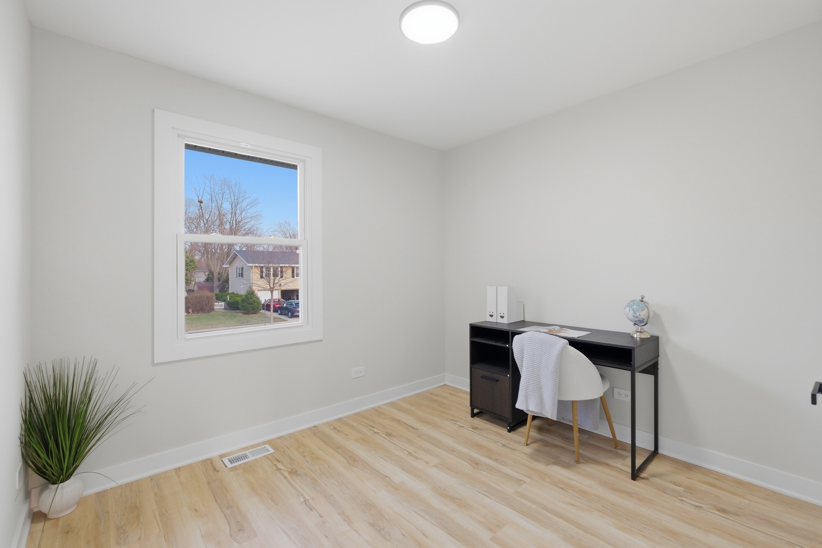 1450 Meyer Road Hoffman Estates, IL 60169 - Photo 12 of 28 a view of a workspace with furniture and wooden floor