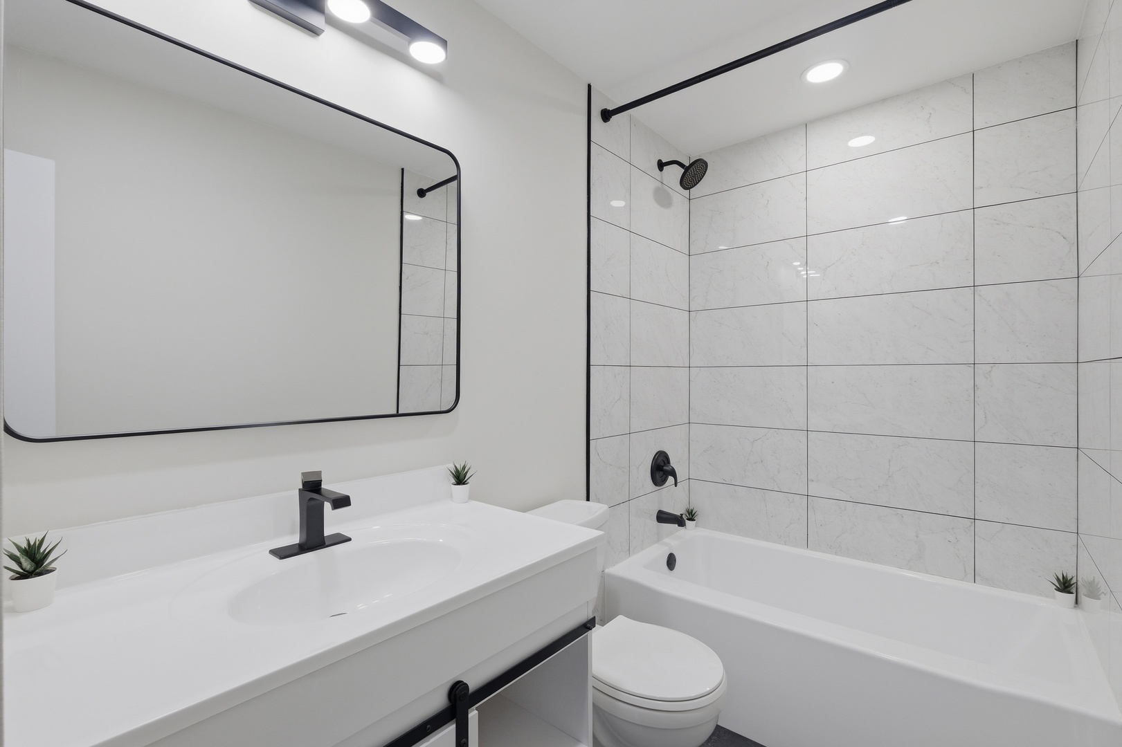 1450 Meyer Road Hoffman Estates, IL 60169 - Photo 13 of 28 a bathroom with a bathtub shower sink and toilet