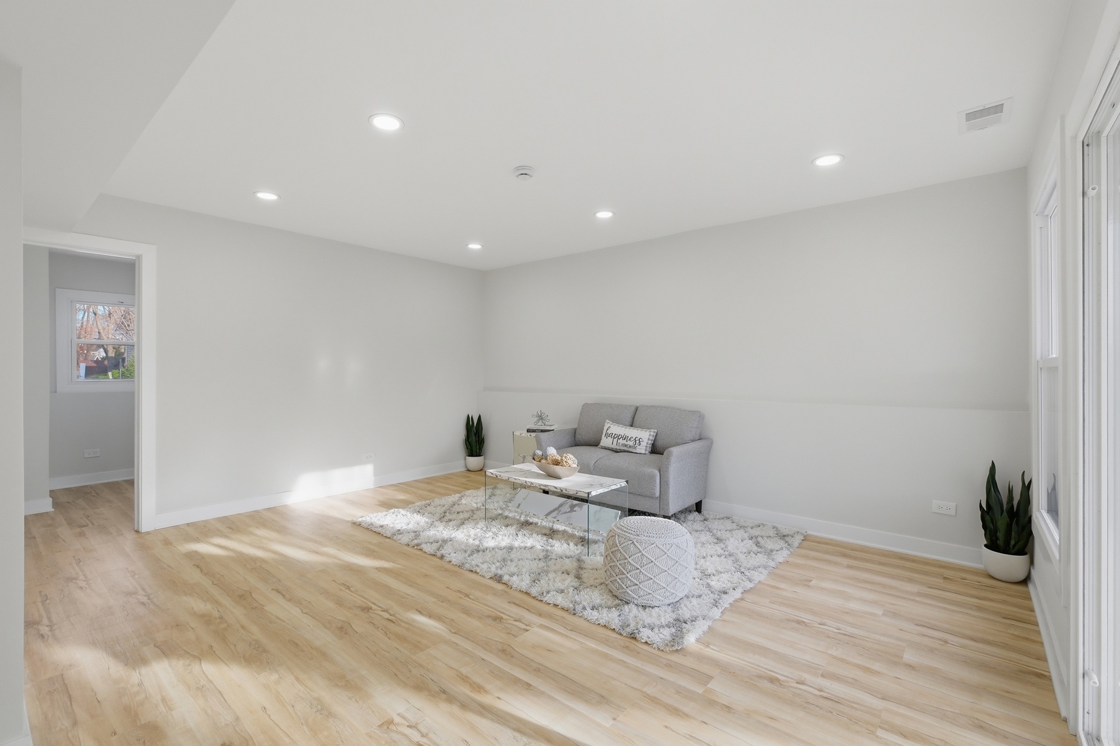 1450 Meyer Road Hoffman Estates, IL 60169 - Photo 15 of 28 a room with a bed and a potted plant on table