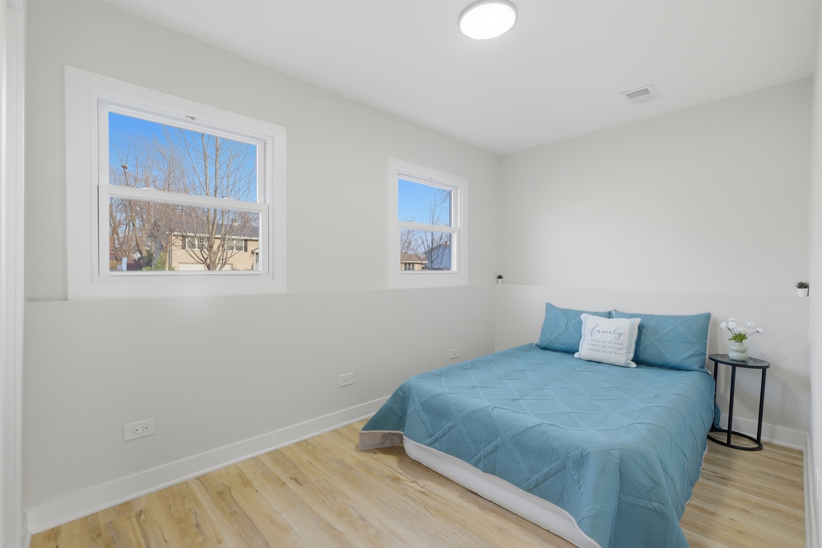 1450 Meyer Road Hoffman Estates, IL 60169 - Photo 16 of 28 a bedroom with a bed and a window