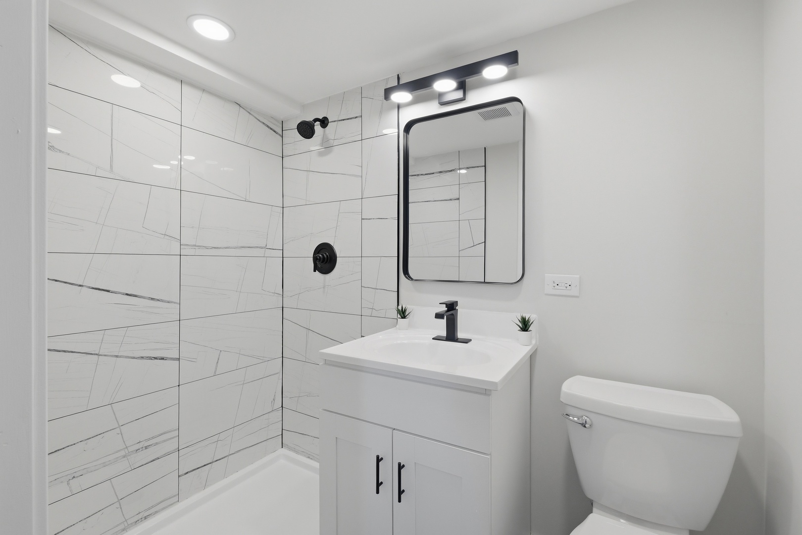 1450 Meyer Road Hoffman Estates, IL 60169 - Photo 17 of 28 a bathroom with a toilet sink and shower