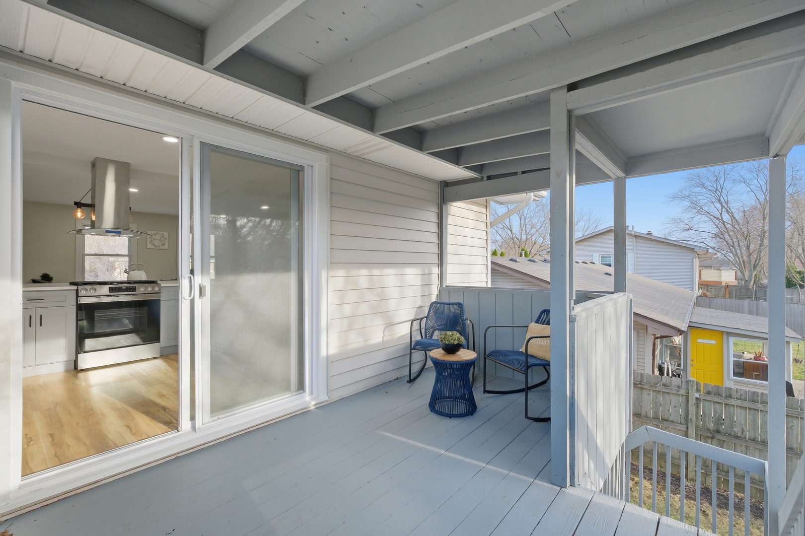 1450 Meyer Road Hoffman Estates, IL 60169 - Photo 19 of 28 a view of a porch with a table and chairs