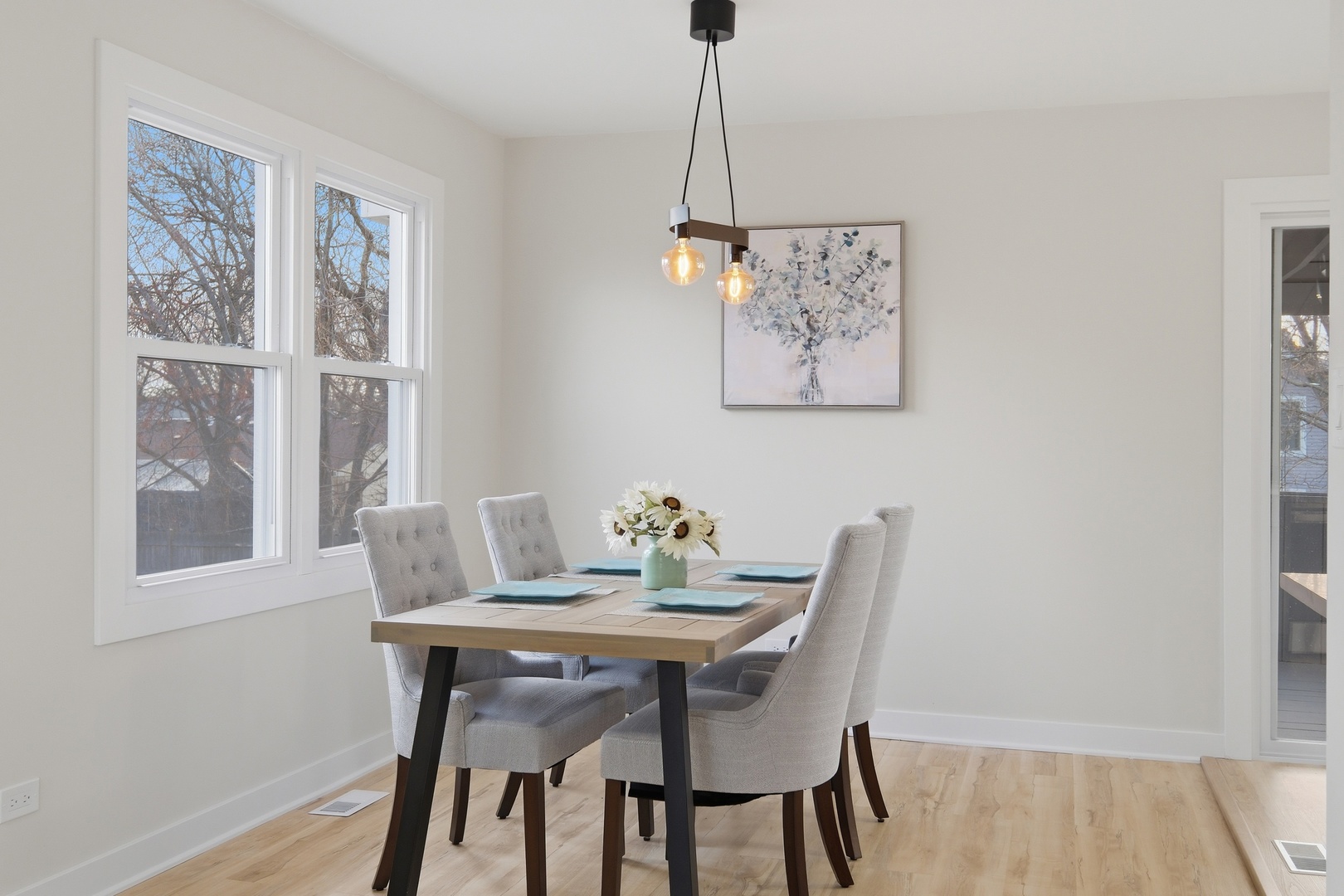 1450 Meyer Road Hoffman Estates, IL 60169 - Photo 9 of 28 a view of a dining room with furniture window and wooden floor