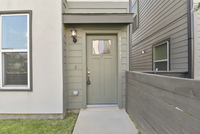 a view of a door and a window of the house