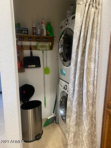 a utility room with sink dryer and washer