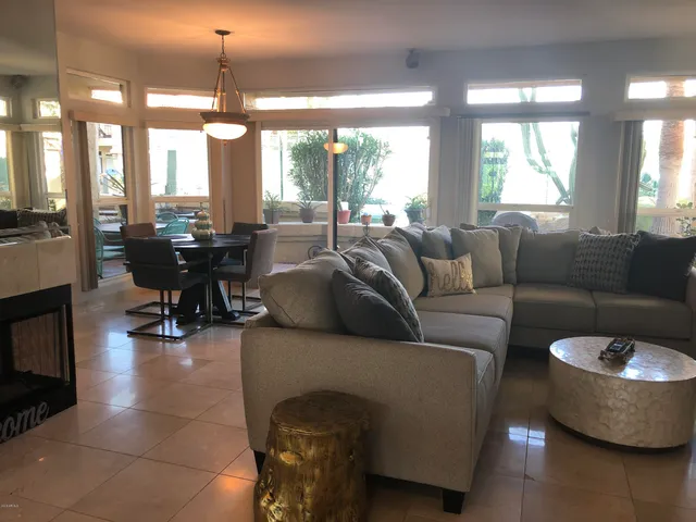 a living room with furniture and a large window