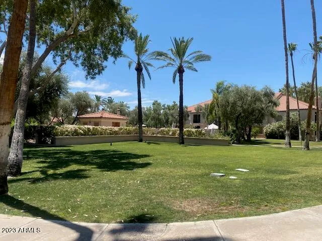 a view of a swimming pool with a lounge chair