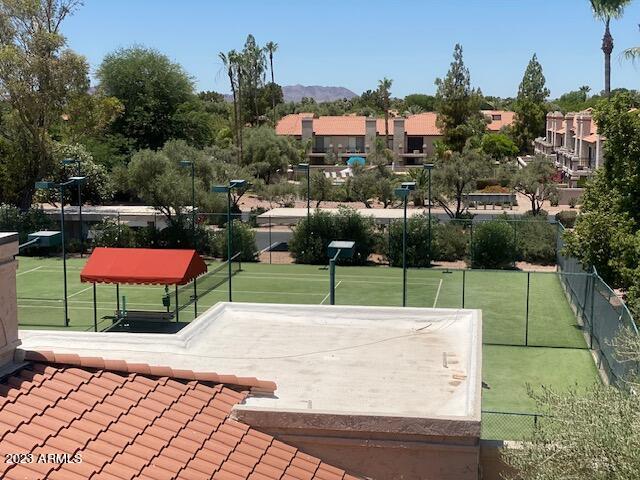9707 East Mountain View Road, Unit 1414 Scottsdale, AZ 85258 - Photo 34 of 40 a view of a tennis ground with large trees