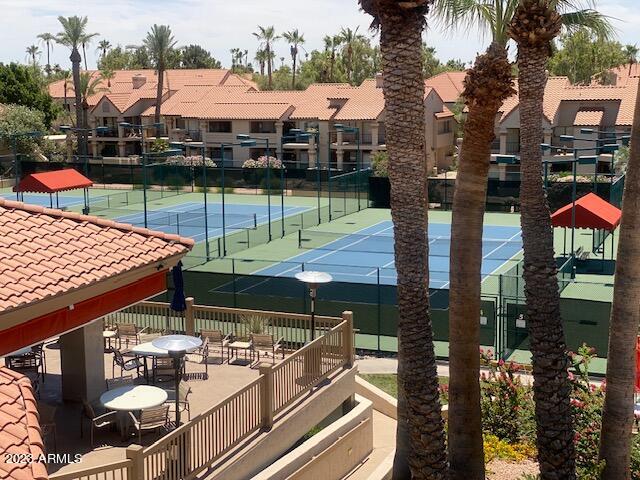9707 East Mountain View Road, Unit 1414 Scottsdale, AZ 85258 - Photo 35 of 40 a outdoor view of a building with sitting area