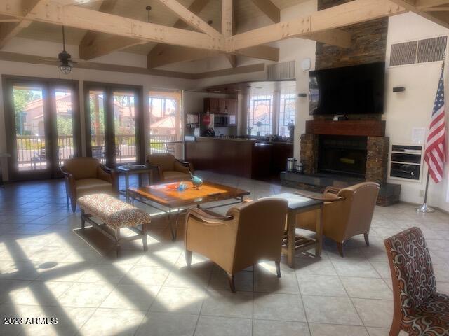 9707 East Mountain View Road, Unit 1414 Scottsdale, AZ 85258 - Photo 40 of 40 a living room with furniture a flat screen tv and a fireplace