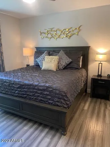 a bedroom with a bed and window