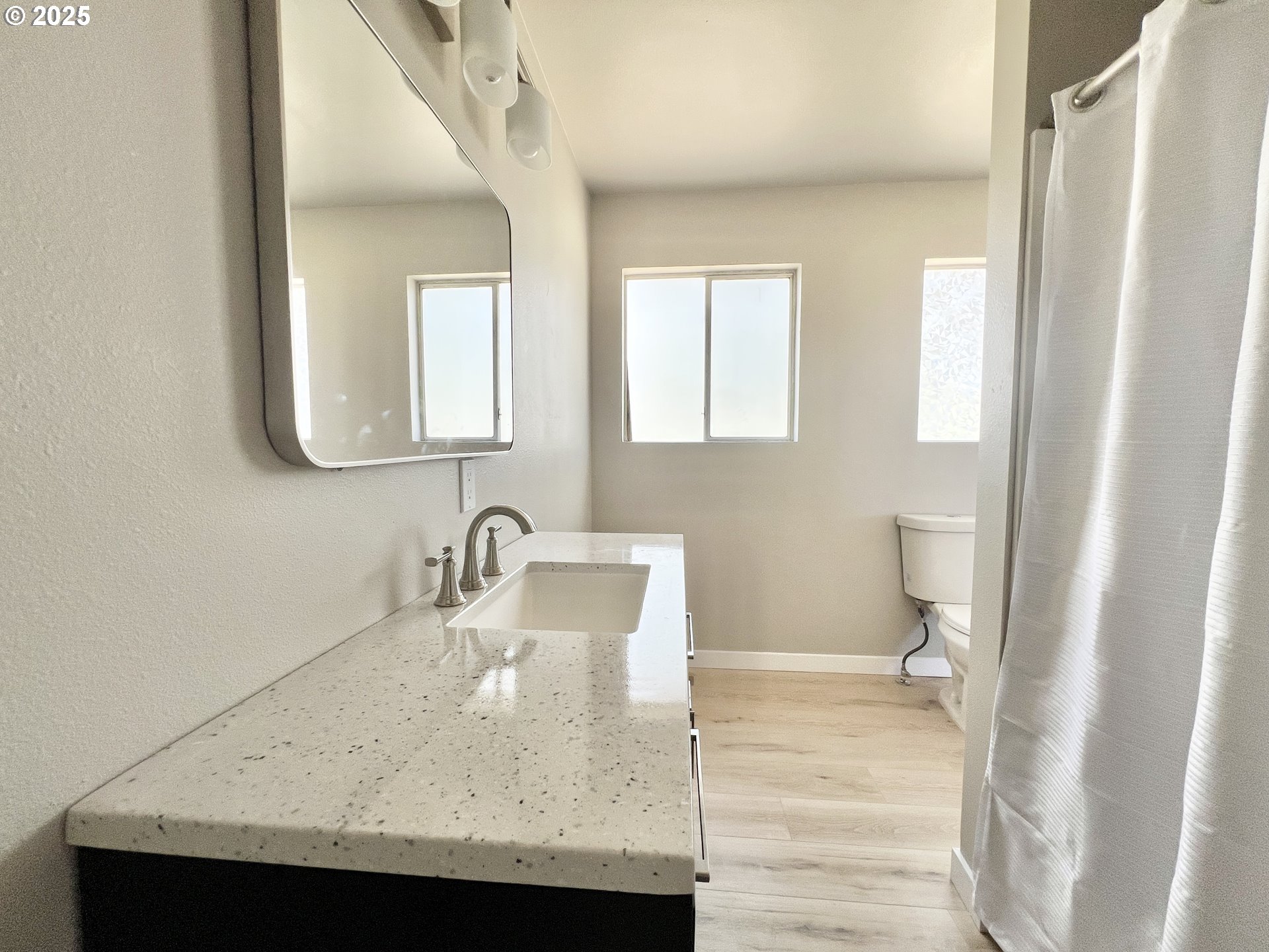 32540 East Punkin Center Road Hermiston, OR 97838 - Photo 13 of 19 a bathroom with a sink a toilet and a mirror