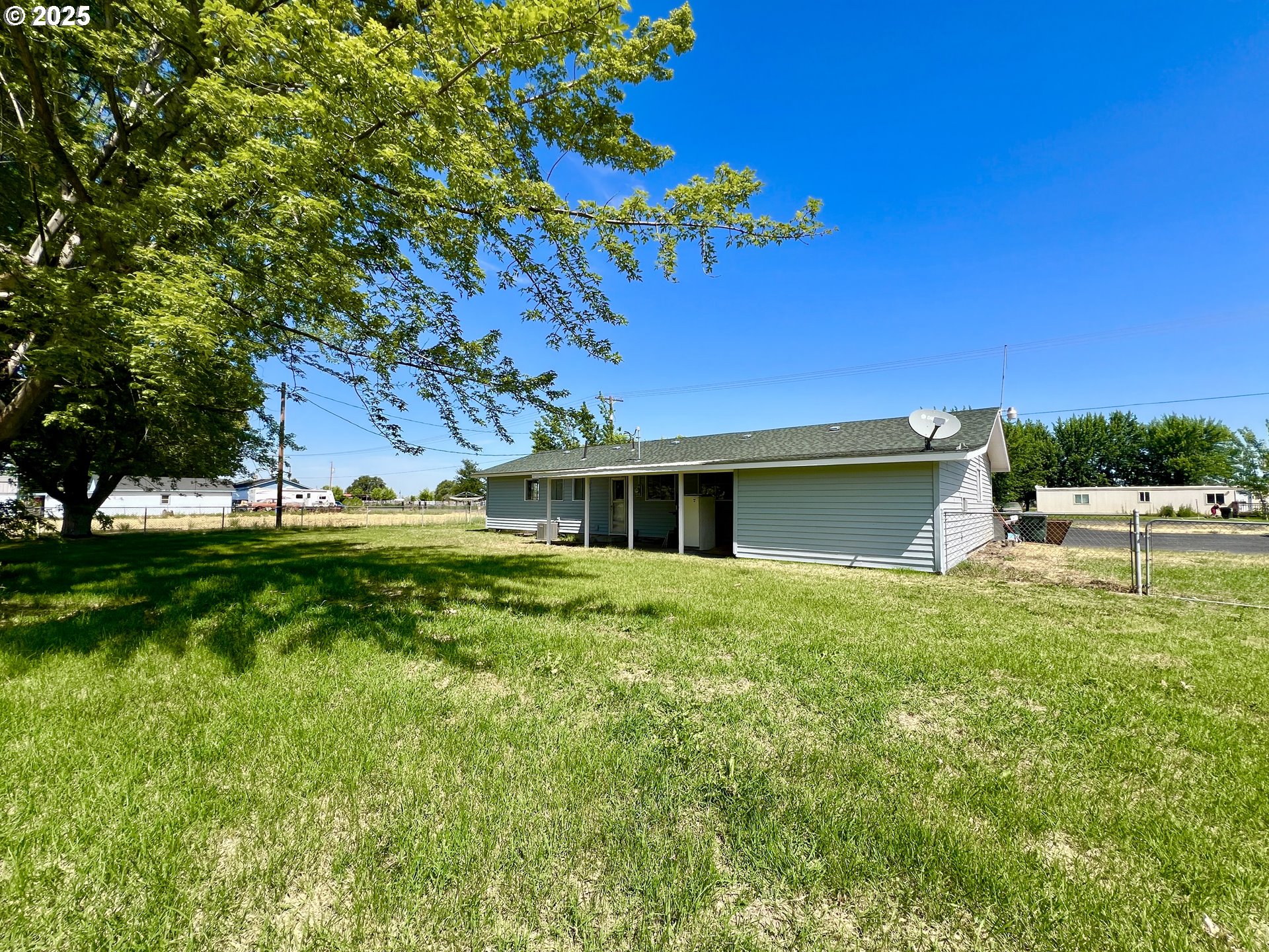 32540 East Punkin Center Road Hermiston, OR 97838 - Photo 17 of 19 a view of a house with a backyard
