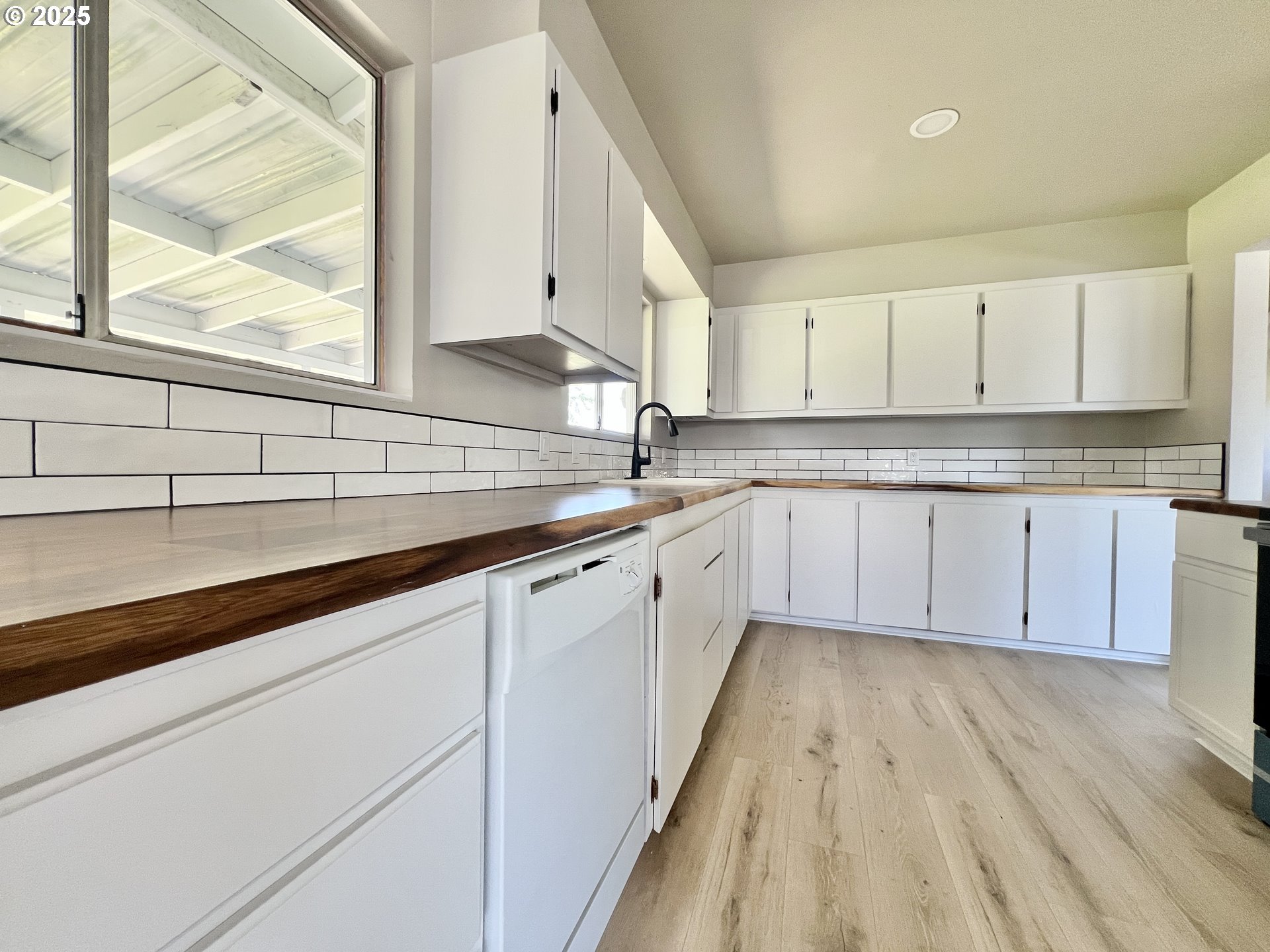 32540 East Punkin Center Road Hermiston, OR 97838 - Photo 6 of 19 a kitchen with sink cabinets and window