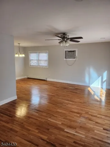 a view of a livingroom with wooden floor