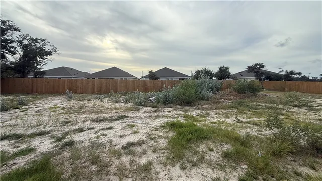 a view of a backyard of the house