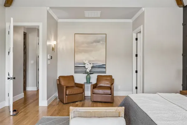 a spacious bathroom with a tub sink and mirror
