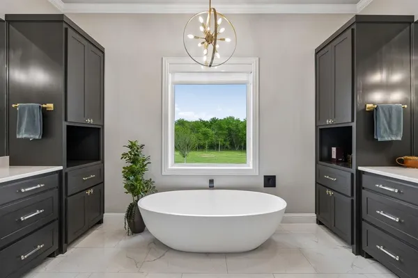 a large bathroom with a double vanity sink a large mirror and shower