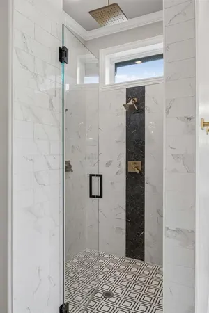 a kitchen with stainless steel appliances granite countertop a refrigerator a sink and wooden cabinets