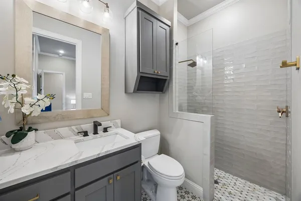 a living room with furniture and a mirror