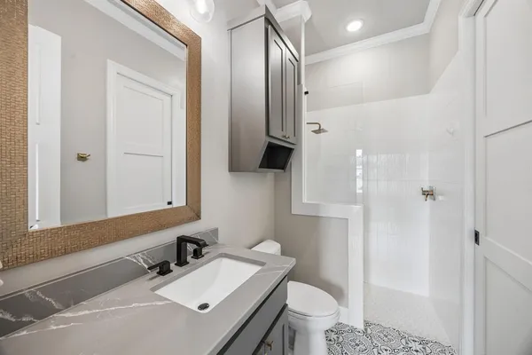 a view of a hallway with wooden floor and dining room