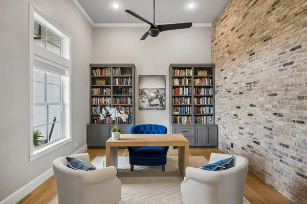 a living room with fireplace furniture and a flat screen tv