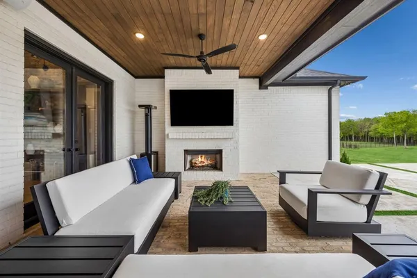 a view of a couches and dinning table in patio