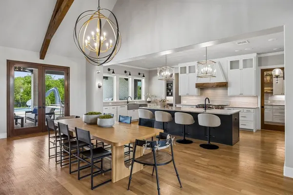 a kitchen with stainless steel appliances a sink stove and refrigerator