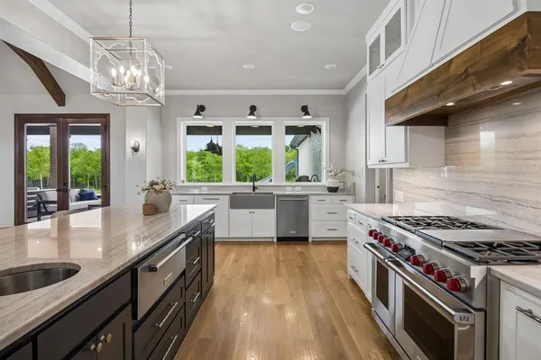 a bathroom with a glass shower door and a mirror