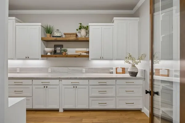 a room with wooden floor and furniture